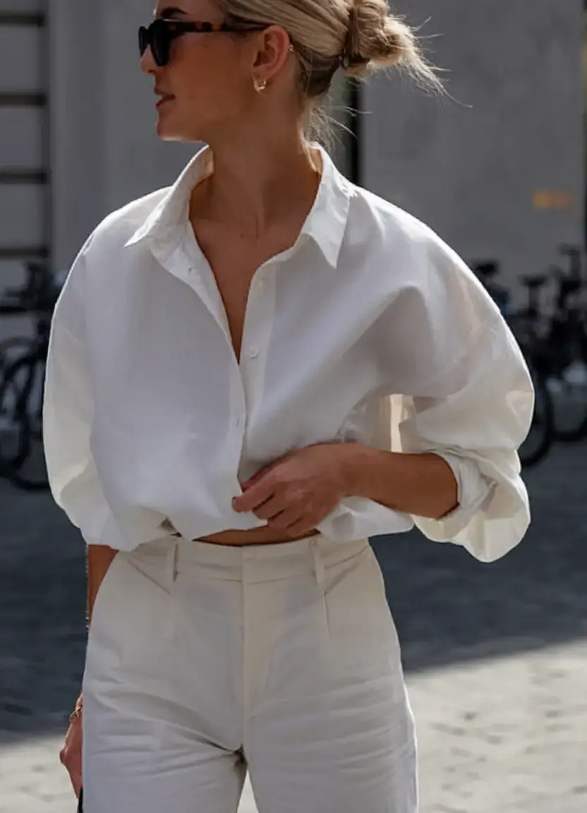business casual outfit ideas for the summer of 2025 Minimal Monochrome: Cropped White Shirt & Tailored Pants