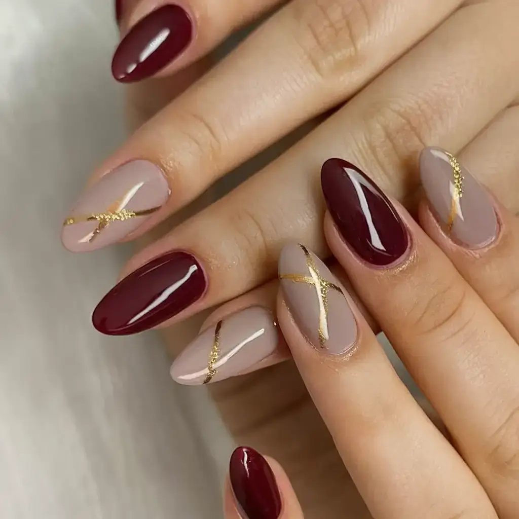 summer almonds nails ideas 2025 Gold-Lined Wine Accents