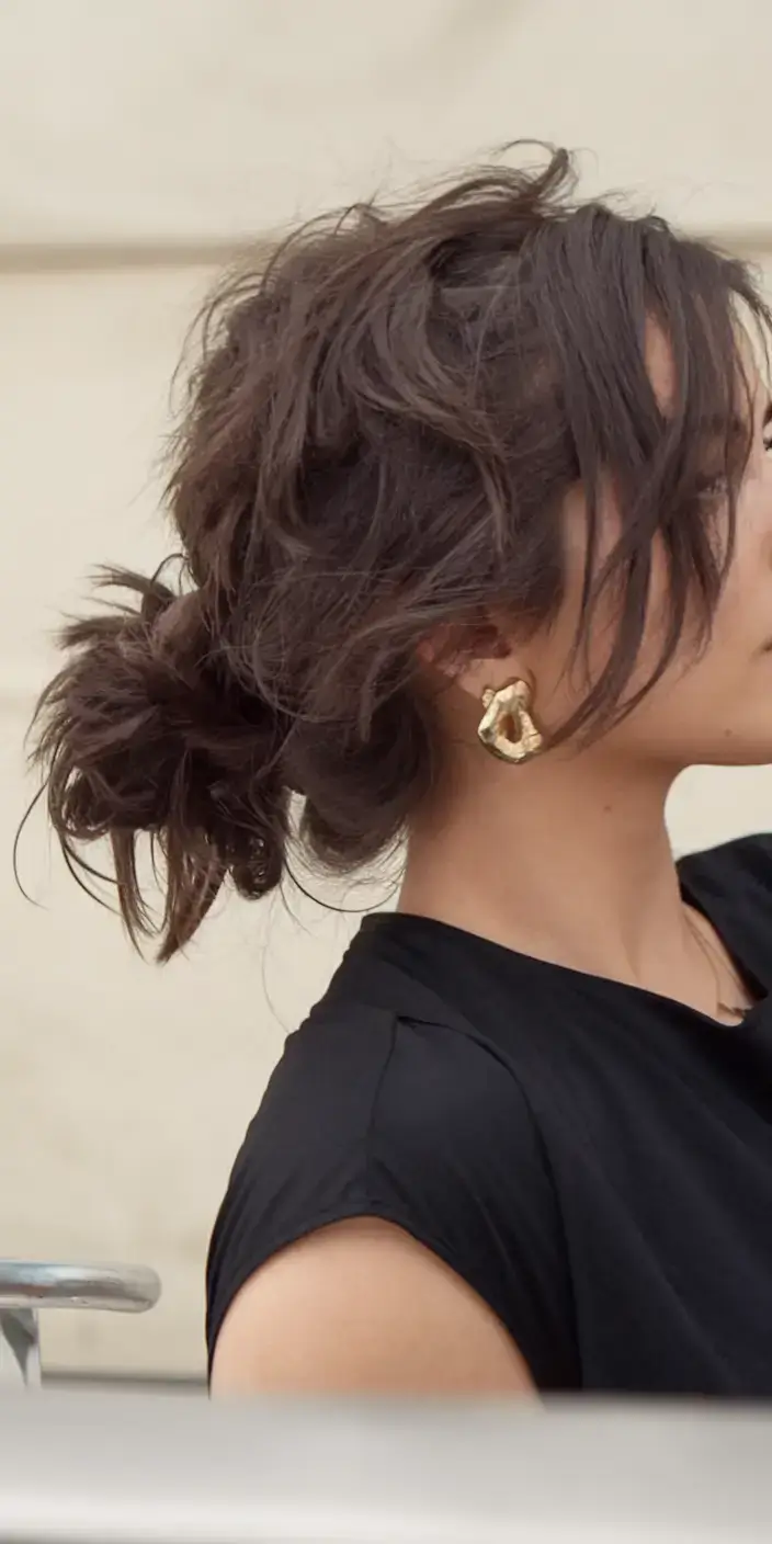summer buns hairstyle 2025 Low Textured Knot with Casual Elegance