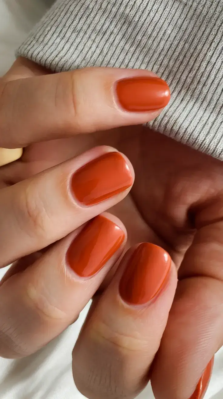 summer nail colors ideas 2025 Spicy Terracotta with a Creamy Finish
