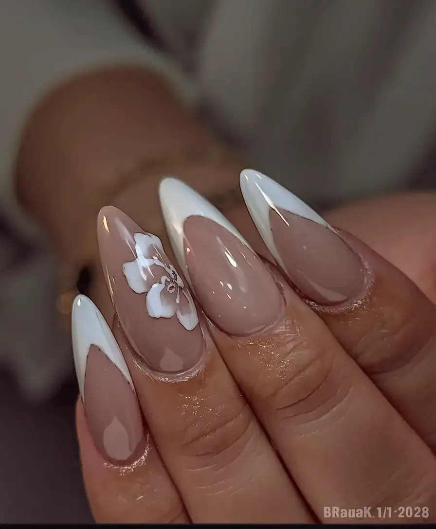 summer nail inspo 2025 Modern French with a Painted Blossom