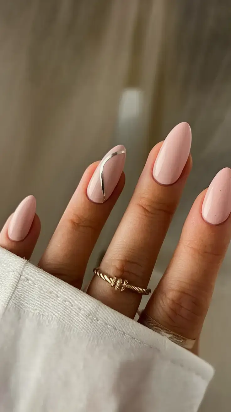 vacation nails ideas 2025 Soft Petal Pink with a Sleek Metallic Wave