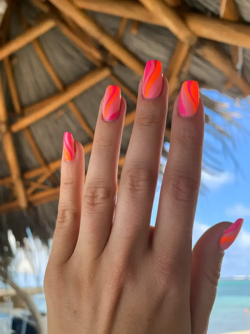 vacation nails ideas 2025 Hot Tropic Swirls in Pink and Orange