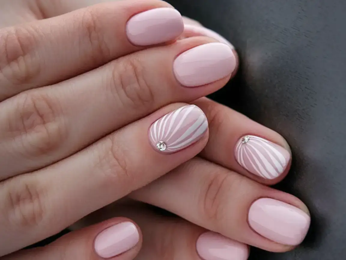 vacation nails ideas 2025 Delicate Shell Art on a Blush Base