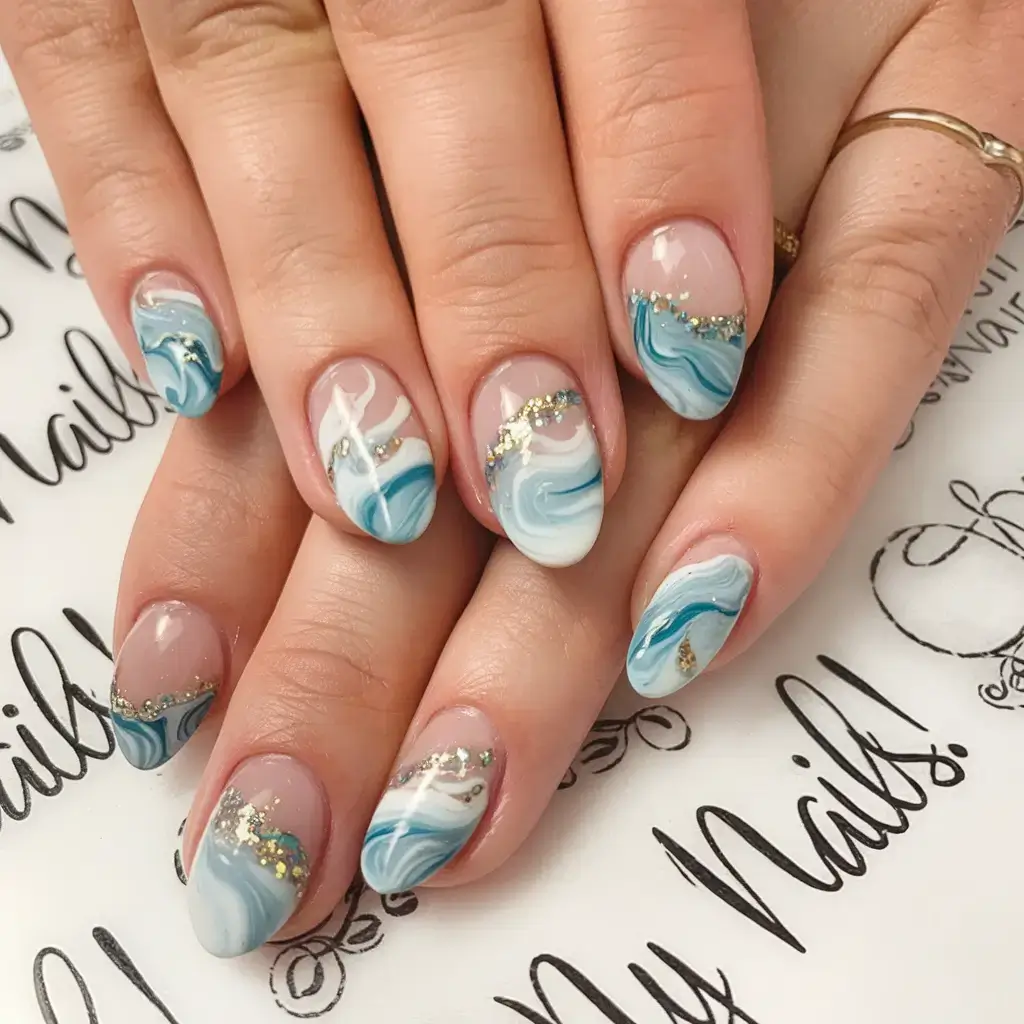 beach nails that shine in summer 2025 Swirling Ocean Marble with Gold Shimmer