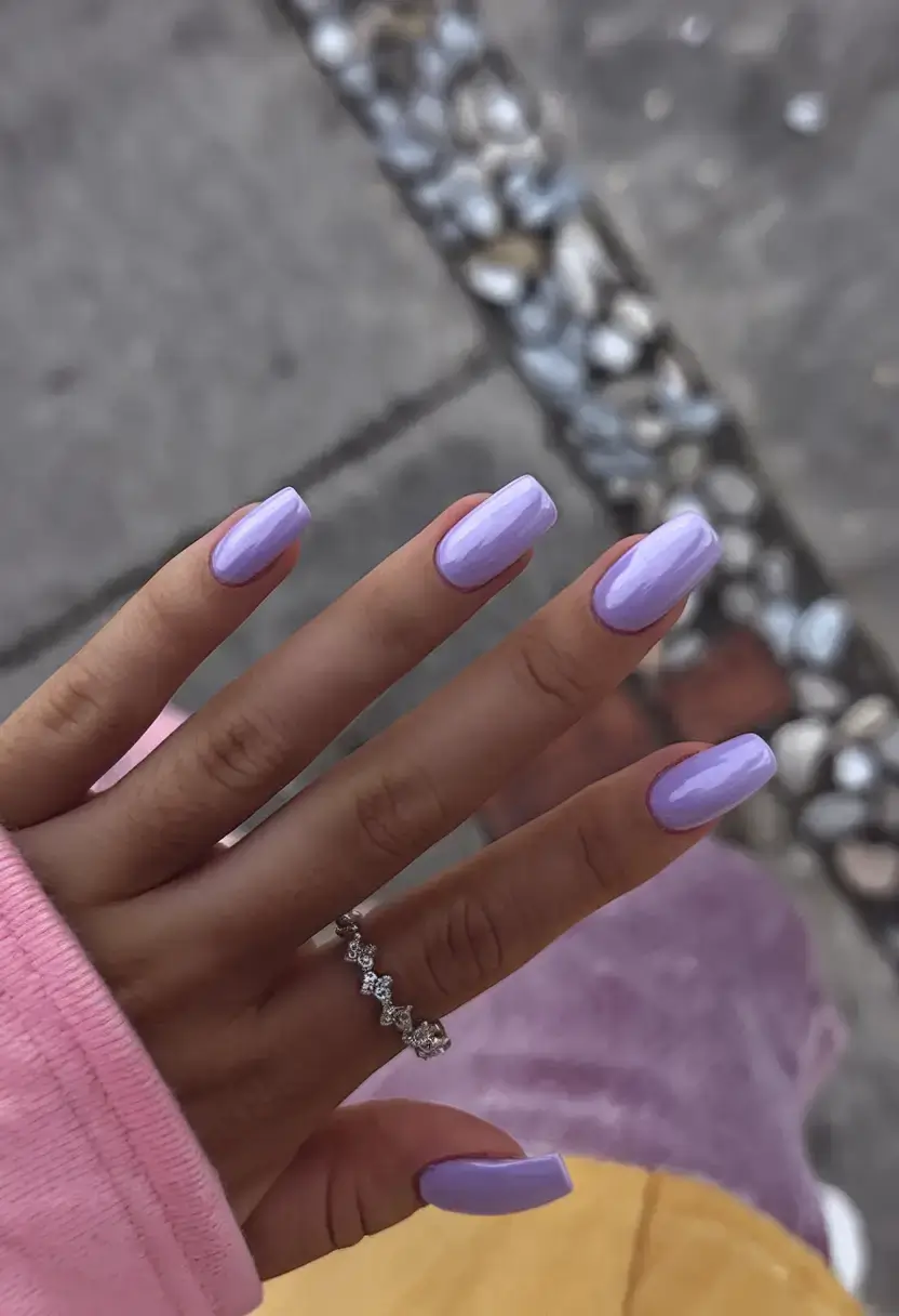 best july nail colors for 2025 Glossy Lilac: A Playful Purple That Pops