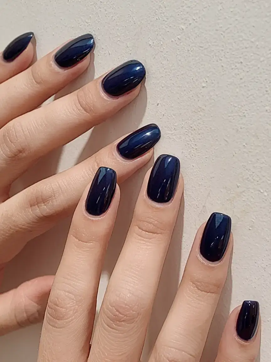 best july nail colors for 2025 Midnight Sapphire: A Bold After-Dark Statement