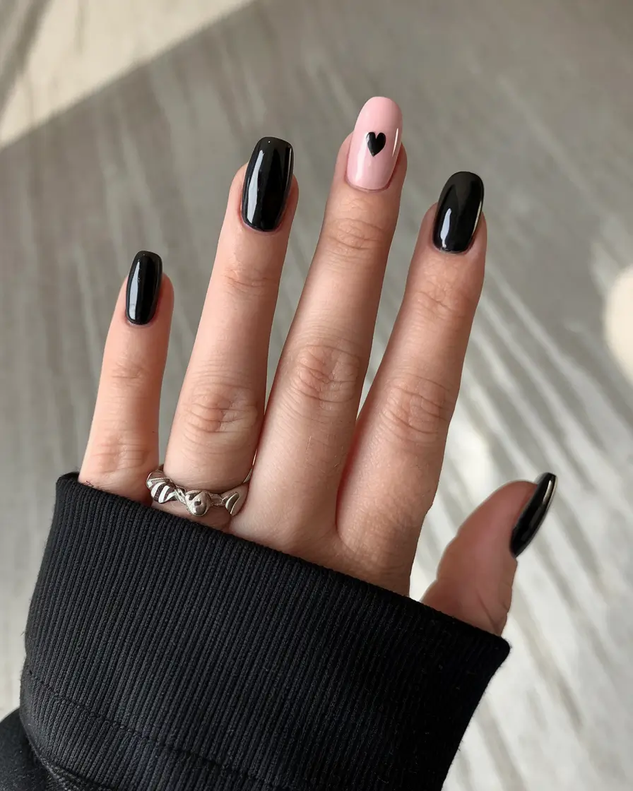 black summer nails that pop in 2025 Blush Accent with Black Heart Detail