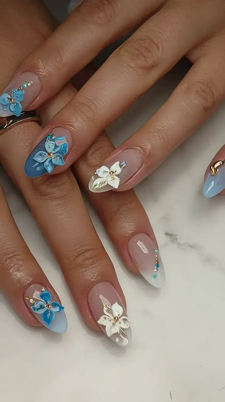 cool blue nail ideas for summer 2025 Blooming Blue Florals with Crystal Accents