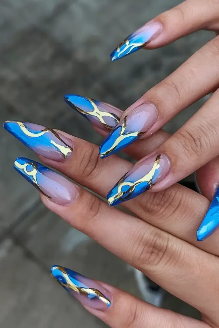 cool blue nail ideas for summer 2025 Electric Marble Tips with Gold Veining