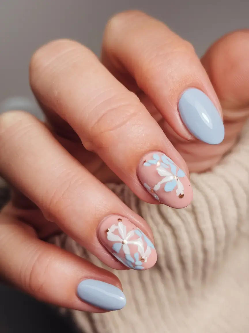 floral nail ideas to bloom in summer 2025 Pastel Baby Blues with Petal Accents