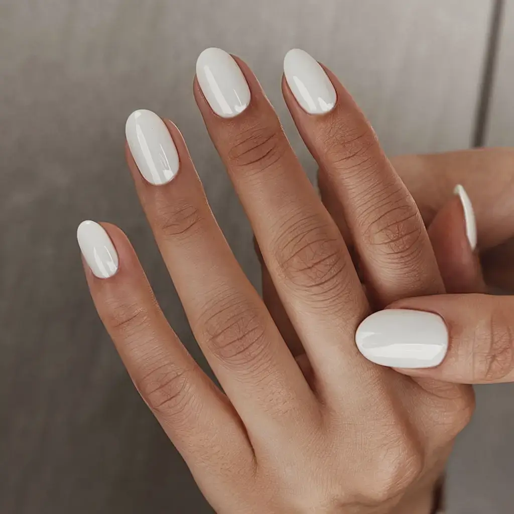 fresh white nail looks for summer 2025 Pure Porcelain Oval Perfection