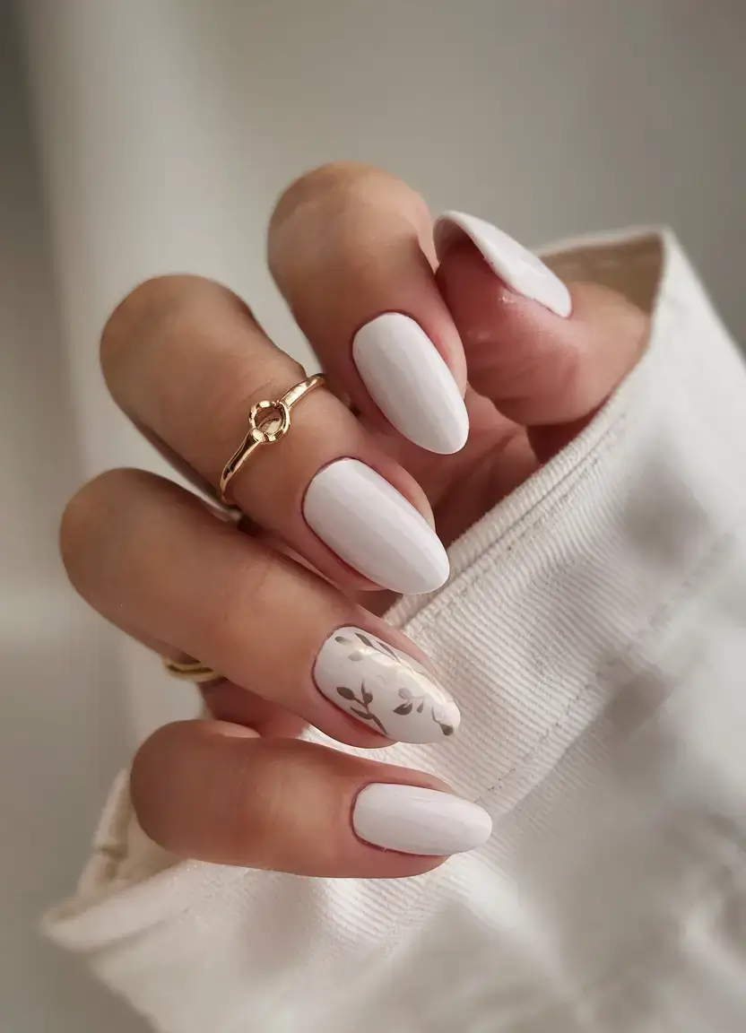 fresh white nail looks for summer 2025 Subtle Floral Accent with Almond Elegance