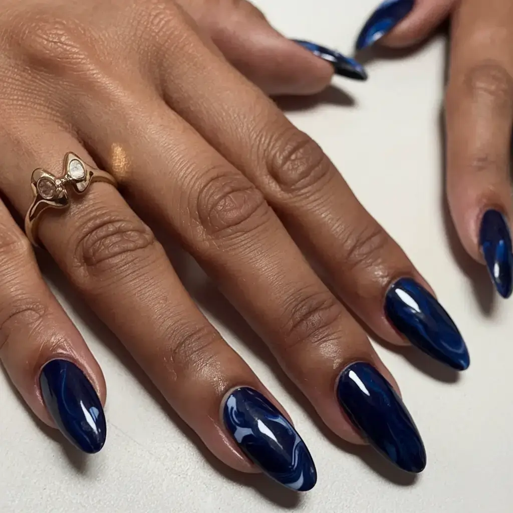 july 2025 nails you’ll want to copy Midnight Marble Waves