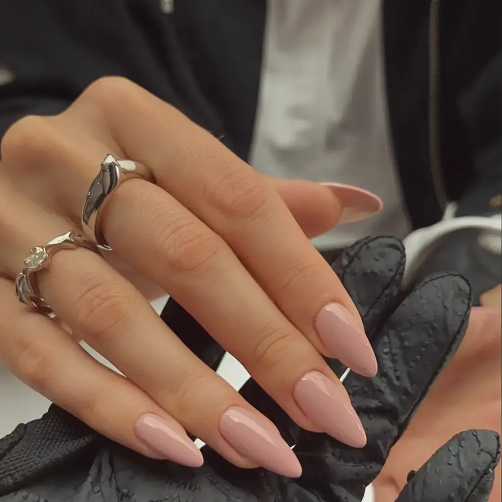 oval nail inspo for summer 2025 looks Glossy Nude With a Stiletto Twist