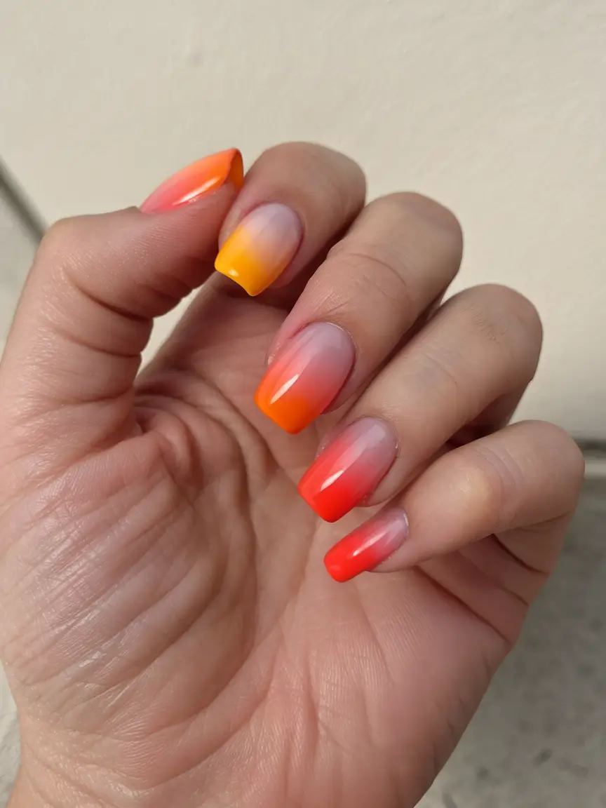 sunset gradient nails to glow in 2025 Tangerine Tips: Tropical Ombre with a Squoval Twist