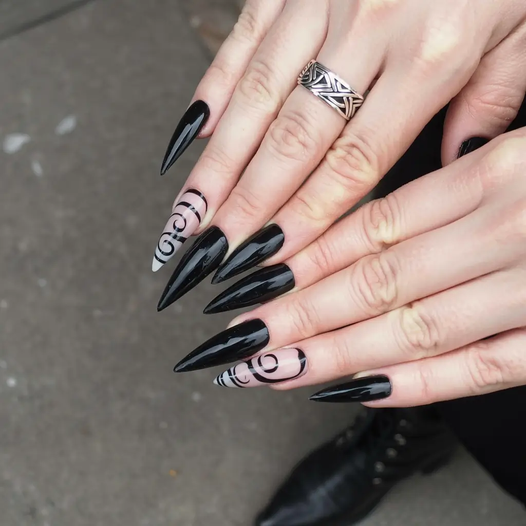 fall black nail designs 2025 Sharp Stilettos with Abstract Swirls