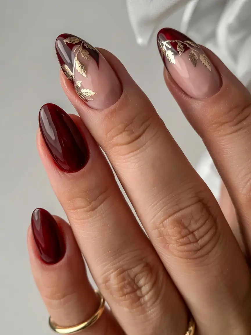 fall nail designs 2025 Deep Burgundy Elegance with Golden Leaf Accents