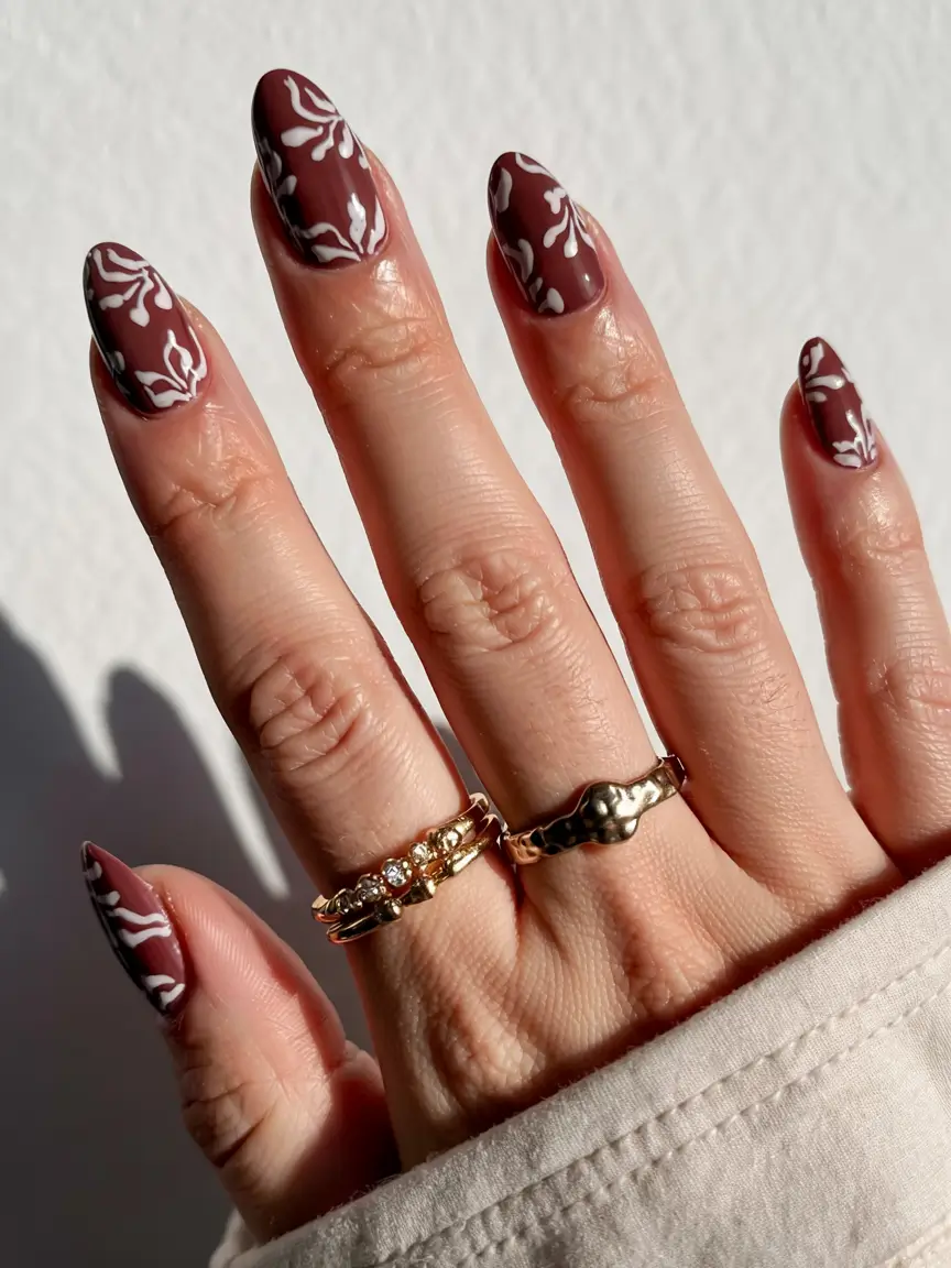 fall nail designs 2025 Chocolate Mocha with White Botanical Detailing