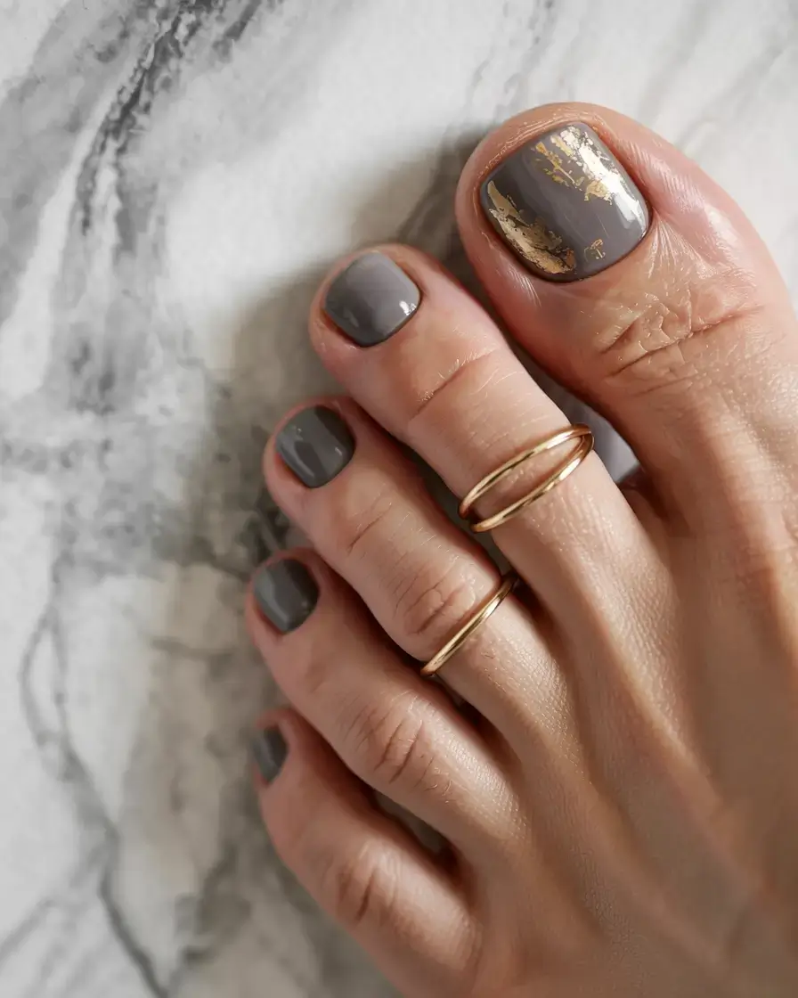 september toe nails ideas 2025 Graystone Glam with Gold Leaf