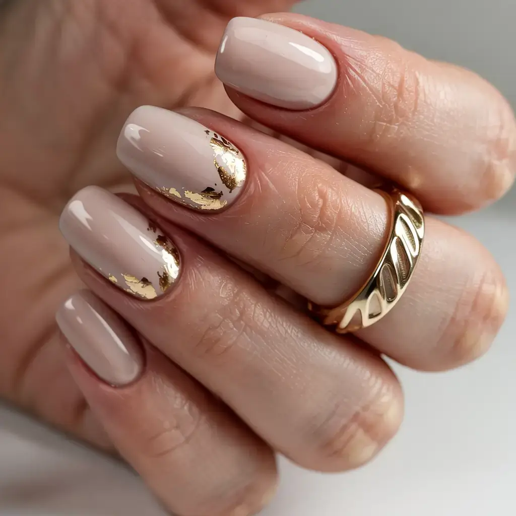 fall foil accent nails 2025 Classic Nude Elegance with Golden Edges