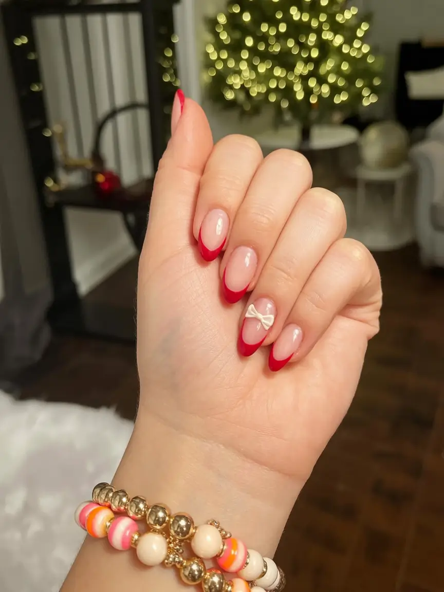 christmas nail art ideas 2025 Subtle French with a Satin Bow