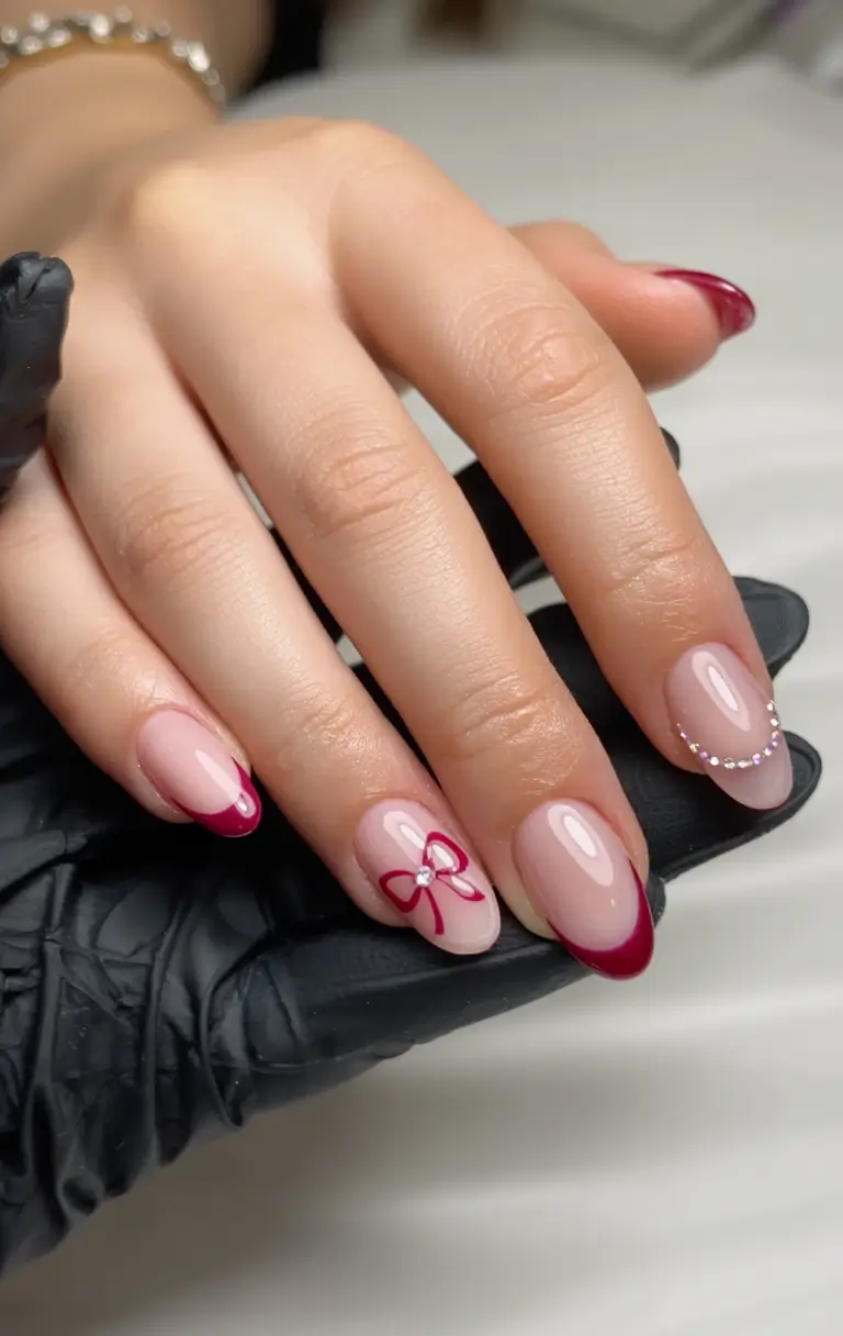 Stylish Christmas French Nails 2025 Crimson Ribbon Charm