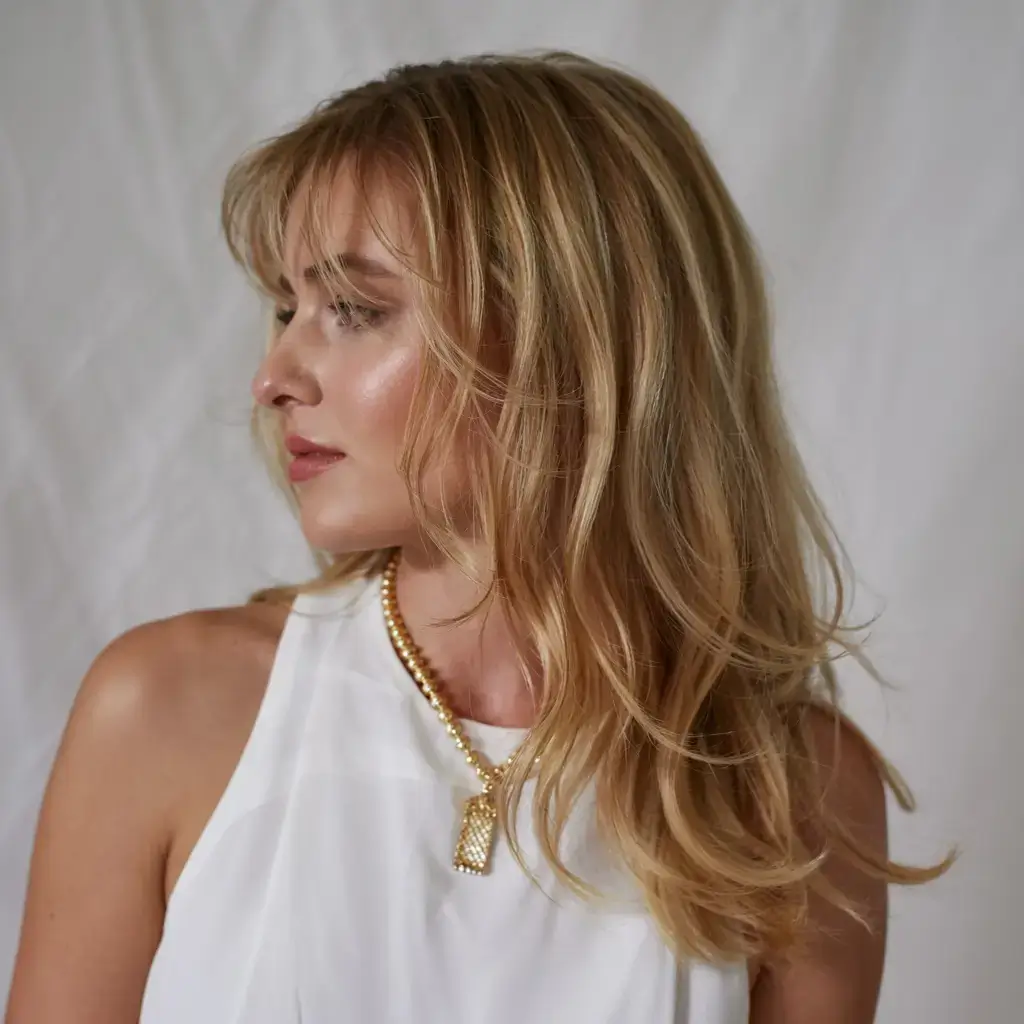 winter haircuts and colors ideas 2025 2026 Butter Blonde Elegance with Soft Curls