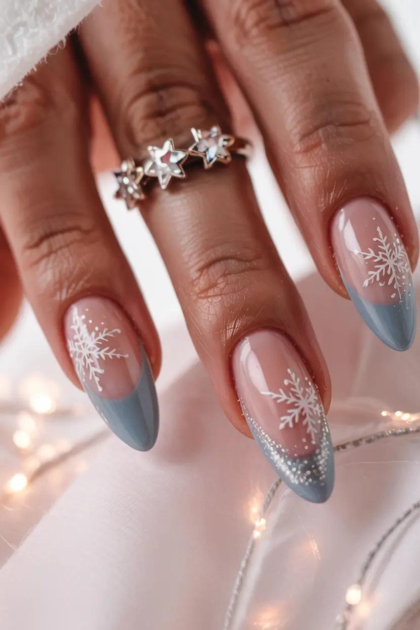 winter nail designs colors 2025 2026 Glacial French Silver-Blue Tips and Snowflake Detailing