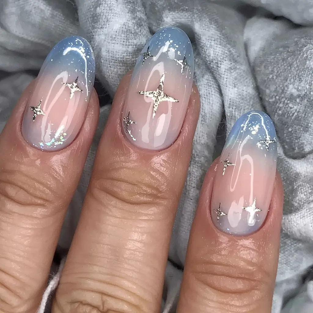 winter nail designs colors 2025 2026 Celestial Fade Blue Ombre with Silver Starlight