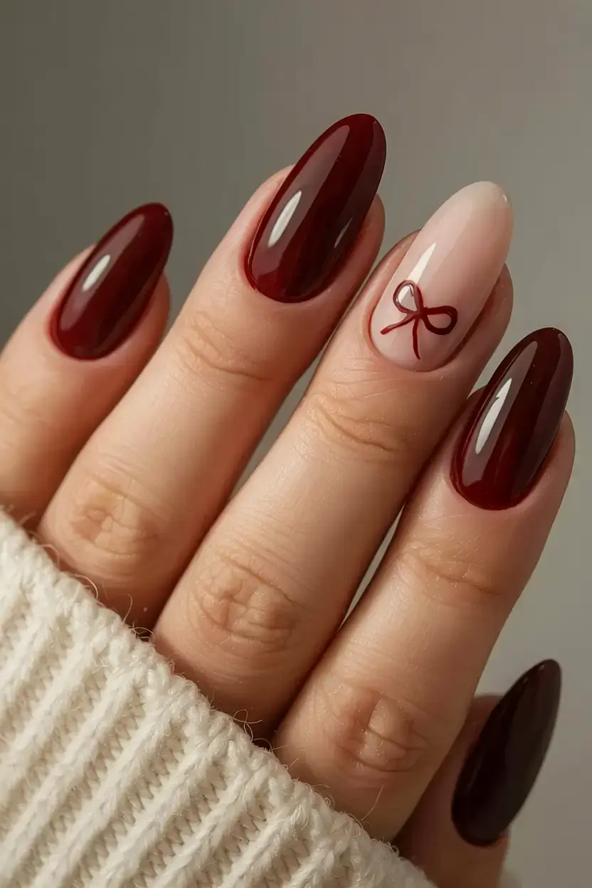christmas nails ideas 2025 2026 burgundy bow minimalism