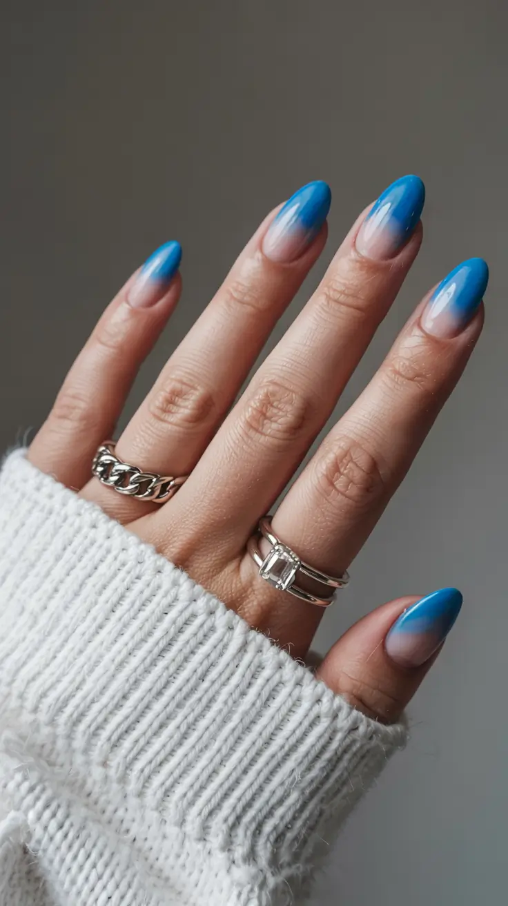 blue nails 2026 Electric Blue Fade With a Soft Nude Base