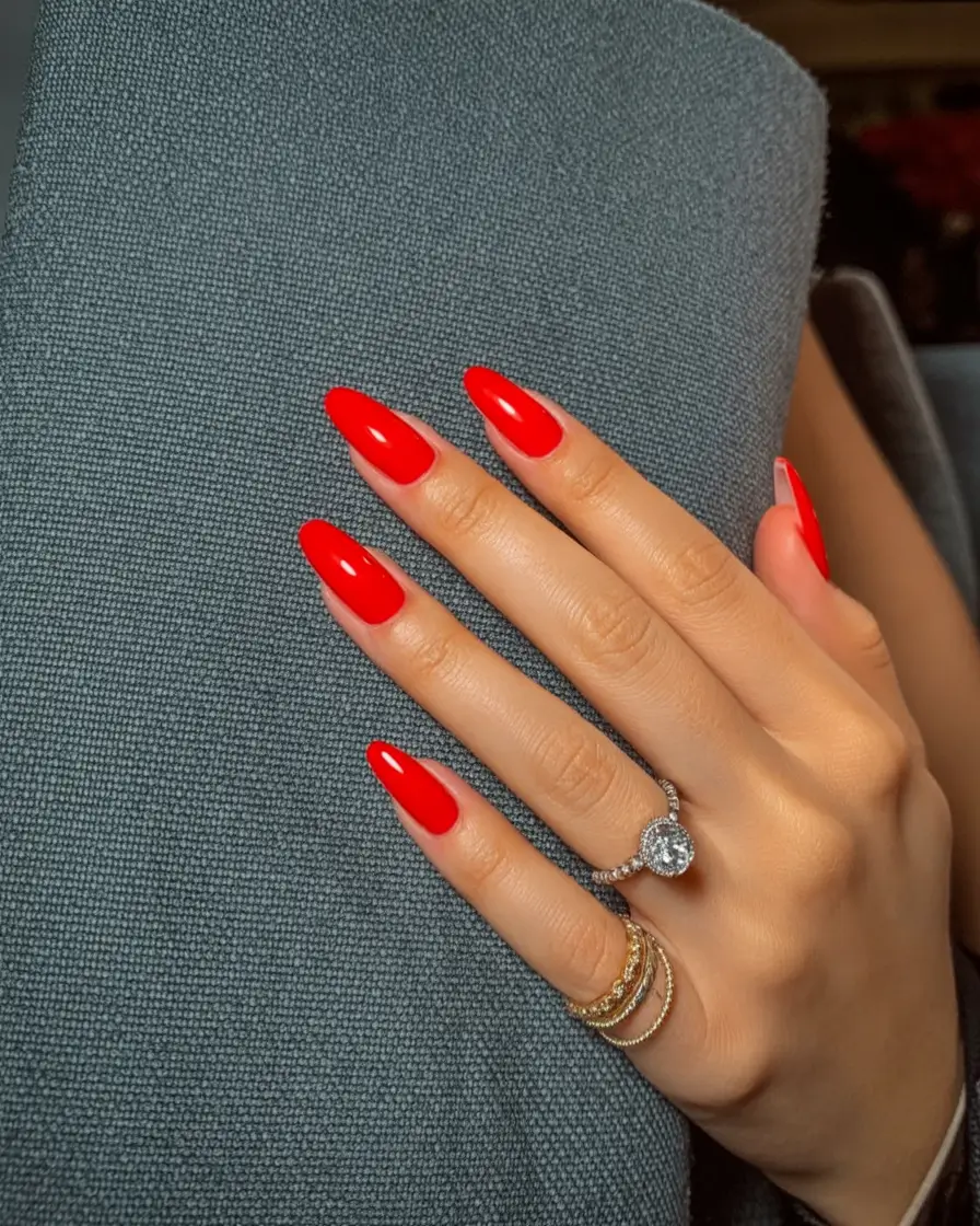 acrylic spring nails trends 2026 Classic Spring Red With a Modern Almond Shape
