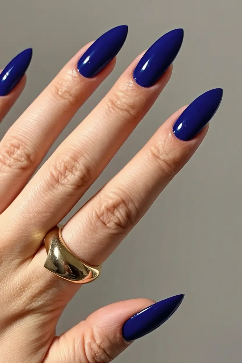 acrylic spring nails trends 2026 Midnight Blue Drama With a Sculpted Stiletto Edge