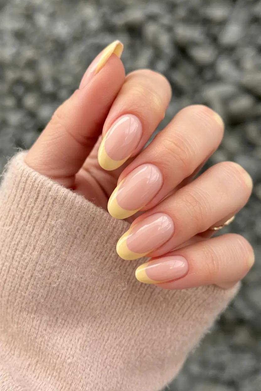 awesome spring french tip nails 2026 Pastel Yellow Almond French Tips for a Soft Spring Glow
