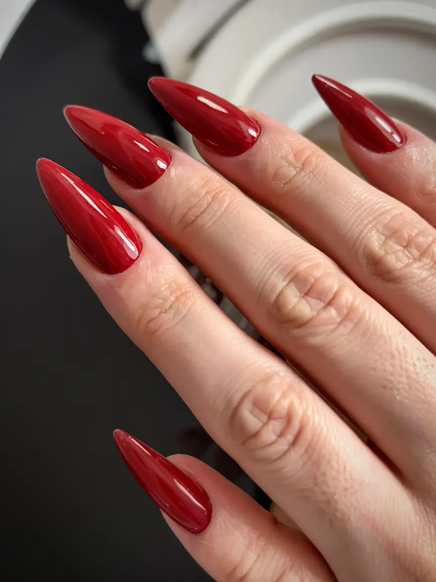 best red spring nails inspo 2026 Deep Ruby Stilettos with Sculpted Drama