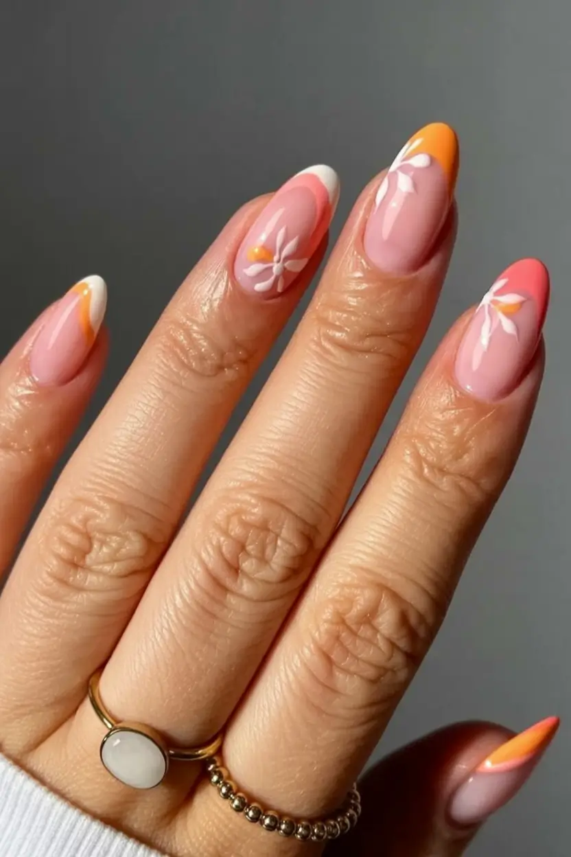 classy early spring nails 2026 Warm Sunset Florals With Peach and Coral Arches