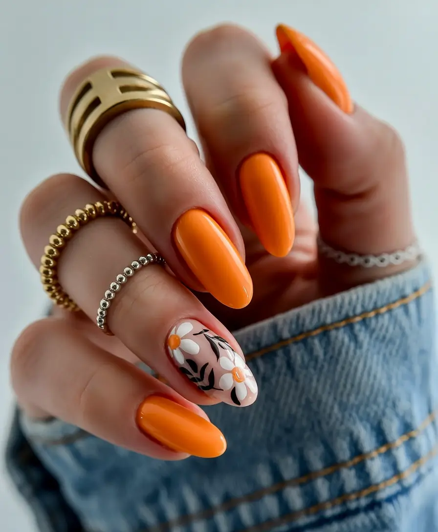 classy early spring nails 2026 Bold Tangerine Gloss With a Daisy Garden Accent