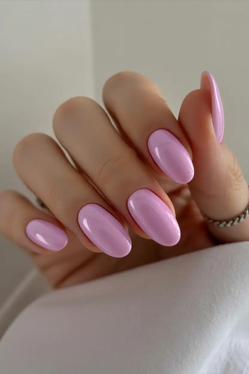 classy early spring nails 2026 Glossy Lilac Almonds for a Subtle Spring Bloom