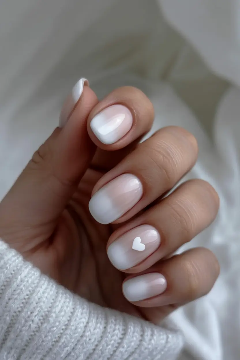 cozy spring wedding nails 2026 Milky Ombre with a Tiny Heart Detail