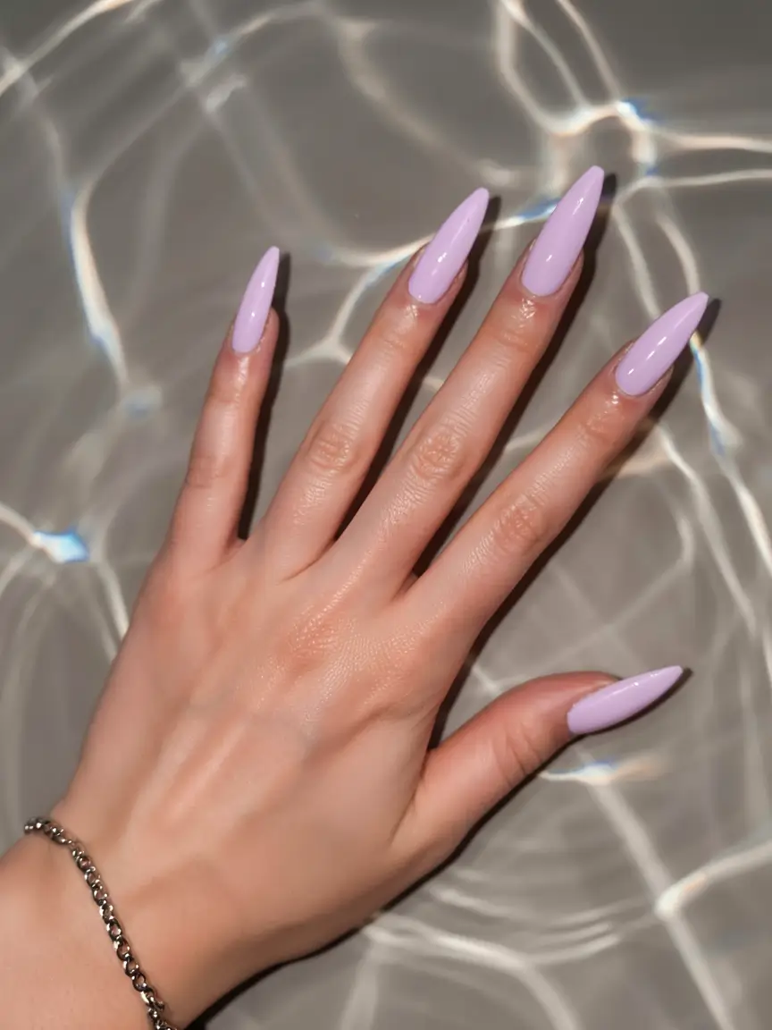 pastel spring stiletto nails 2026 Soft Lilac Stilettos With Glassy Pool-Side Shine