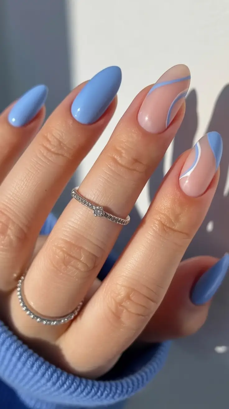stylish blue spring nails for 2026 Spring Swirls in Soft Blue and Barely-There Pink