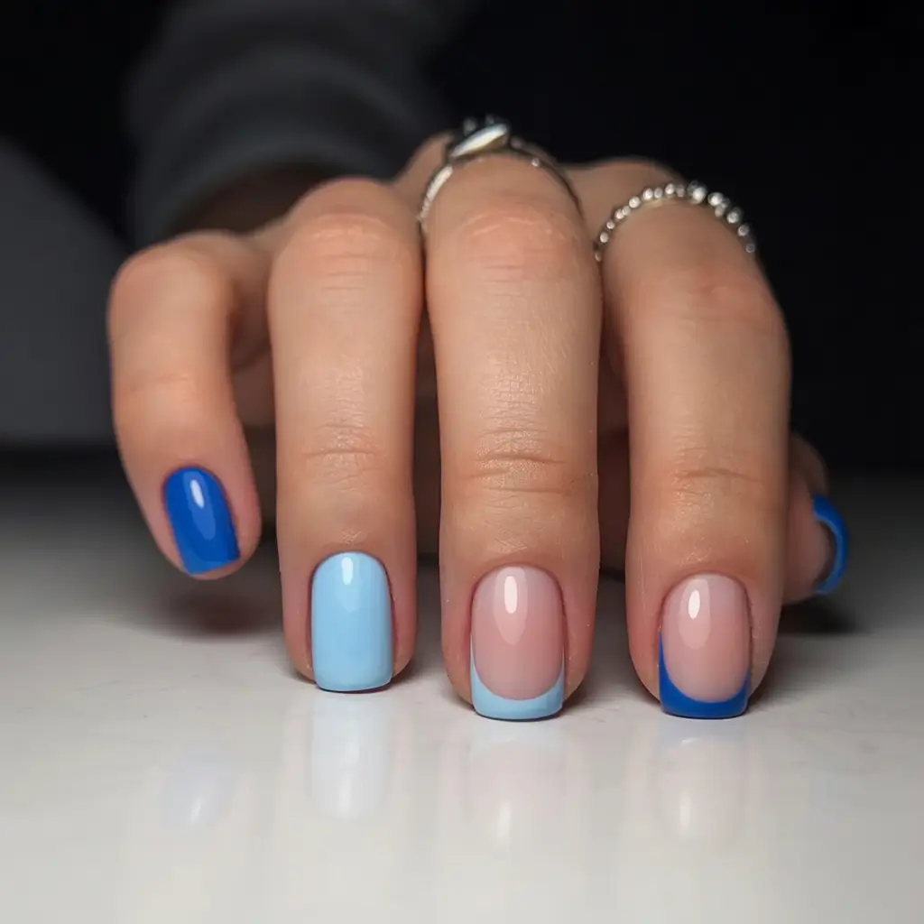stylish blue spring nails for 2026 Gradient Blues and French Tips with a Modern Twist