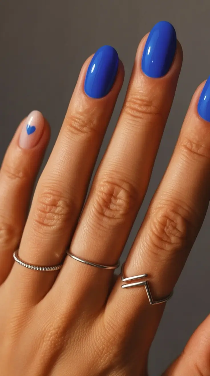 stylish minimalist spring nails 2026 Electric Cobalt With a Mini Heart Accent