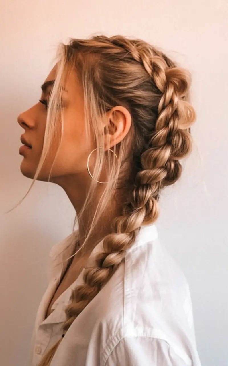 top spring braids hairstyle 2026 Loose Side Braid with Bold, Sculpted Weaving