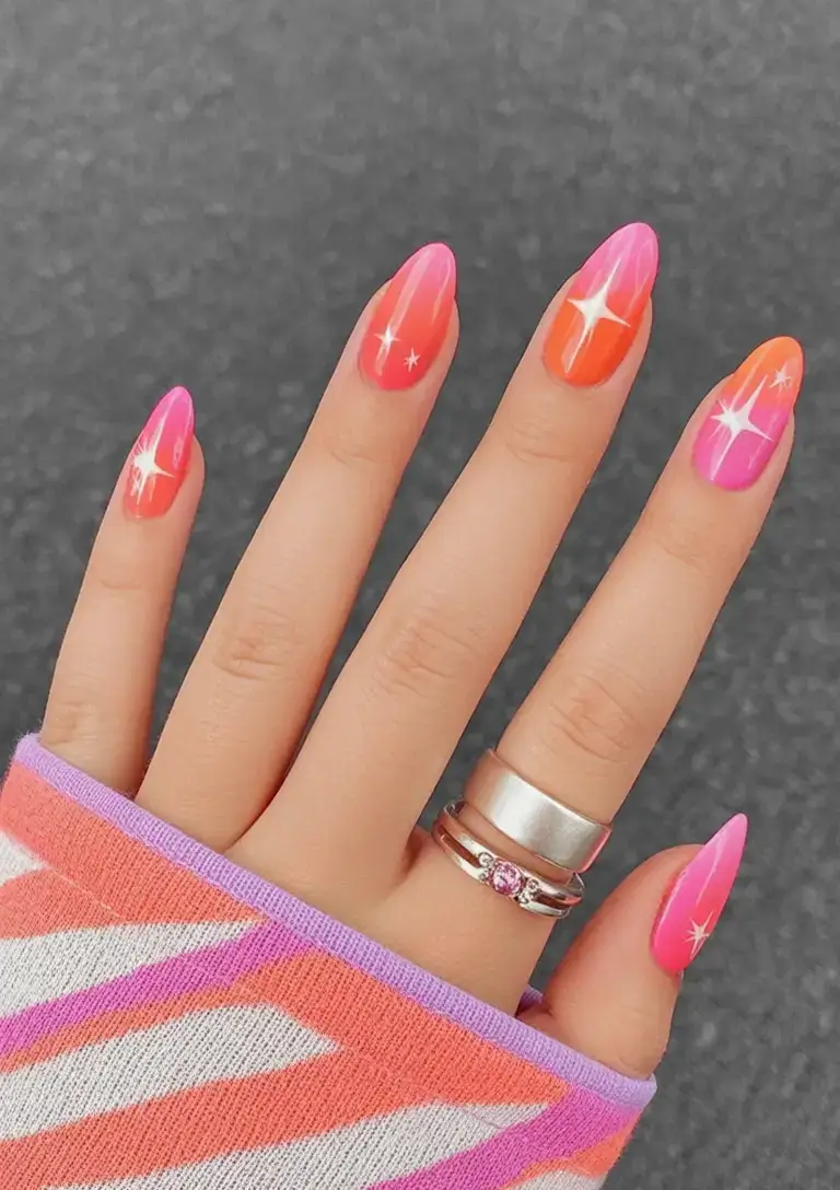 trendy nails for spring 2026 Glossy Glow & Starbursts