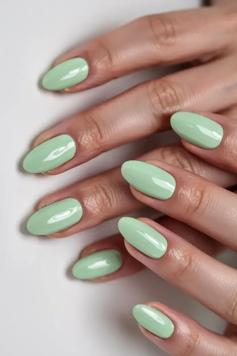 april nails colours spring 2026 Mint Green Glossy Almond Nails