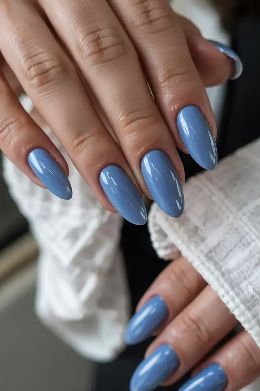 april nails colours spring 2026 Glossy Sky Blue Almond Nails