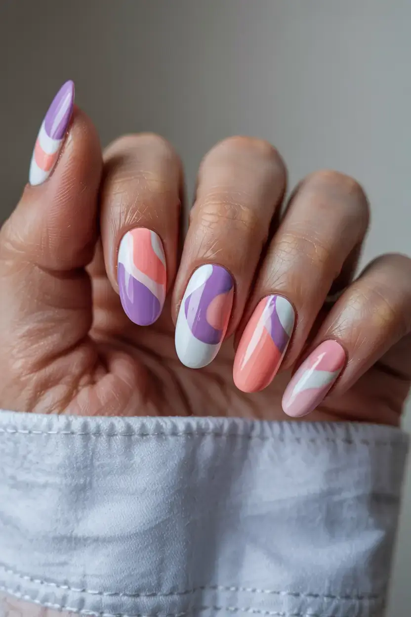 april nails ideas spring 2026 Modern Abstract Pastel Swirl Nails for a Playful Spring Look