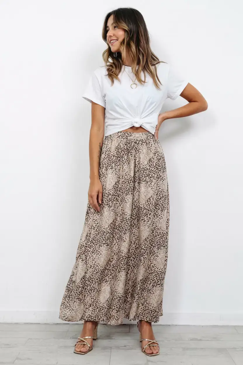 april outfits ideas spring 2026 The Classic White Tee and Flowing Printed Skirt